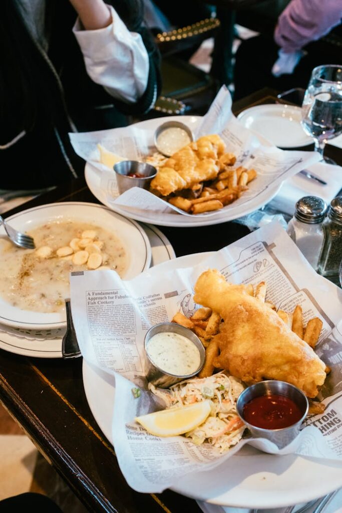 Delectable fish and chips with tartar sauce served in a Vancouver diner.